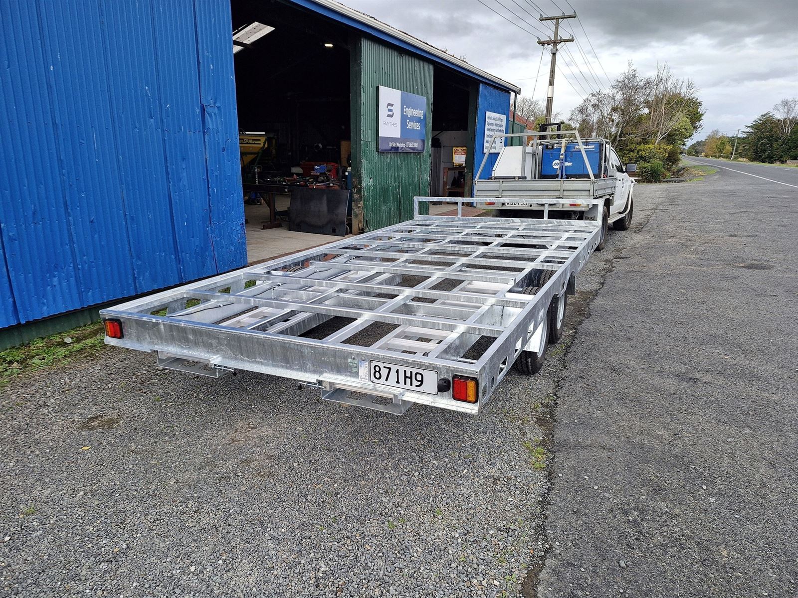 Flat-deck trailer chassis at workshop