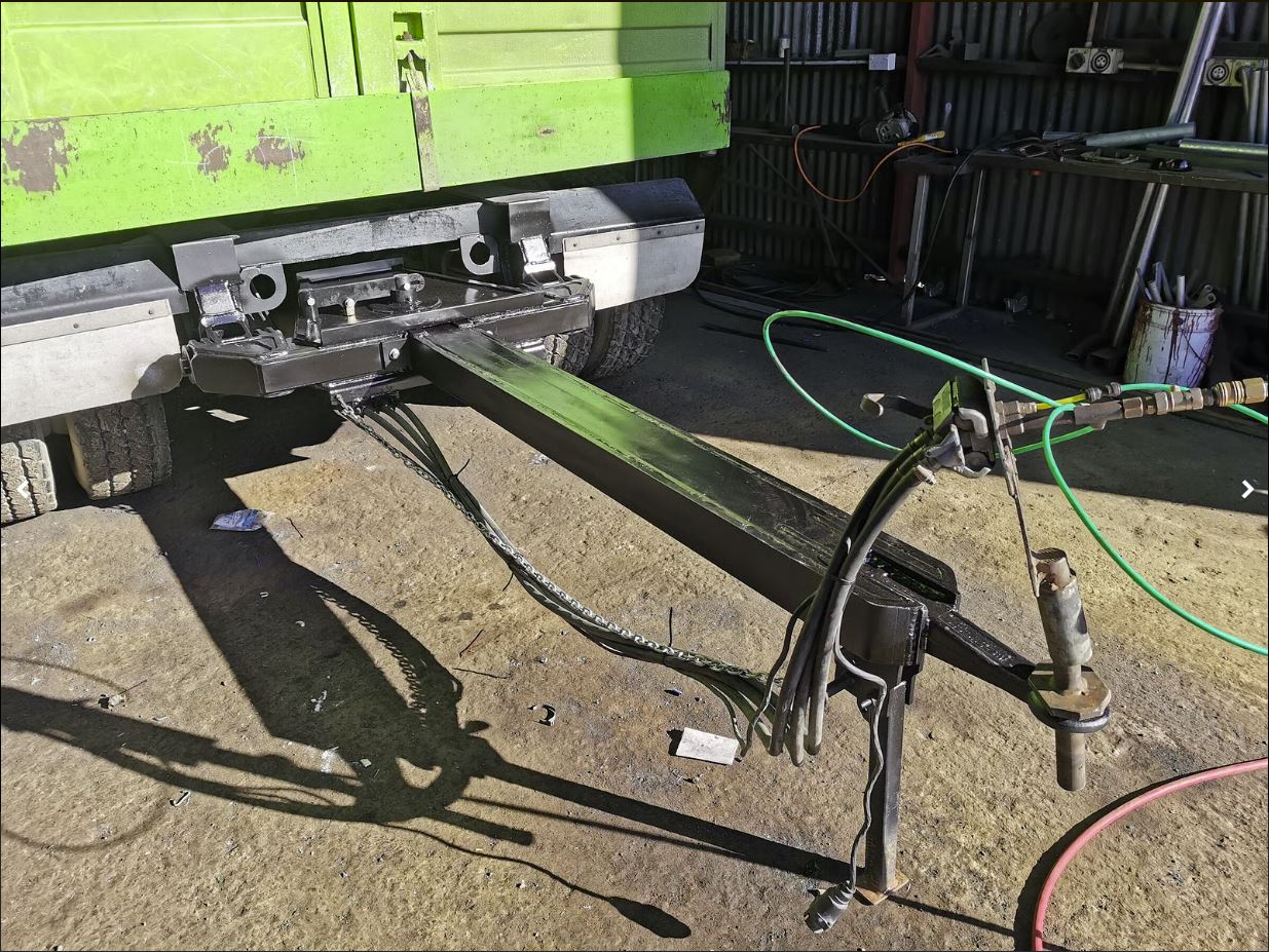 Custom drawbar fitted to a green tipper truck by Cole Engineering
