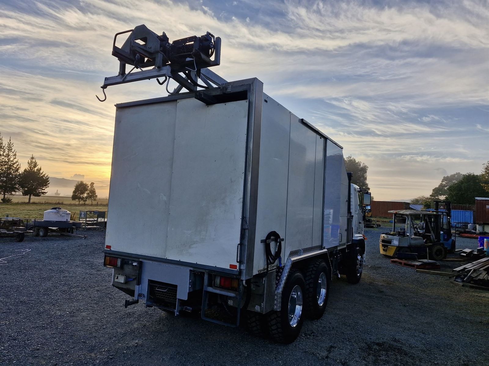Hino 500 service body rear view at sunset