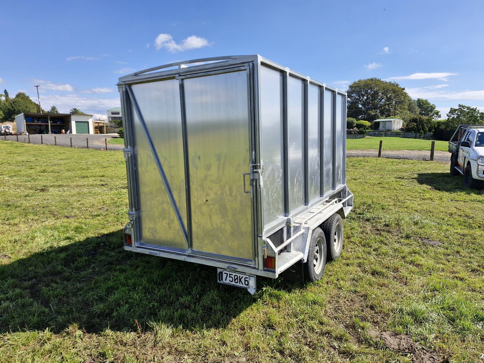Stock crate trailer rear view in paddock